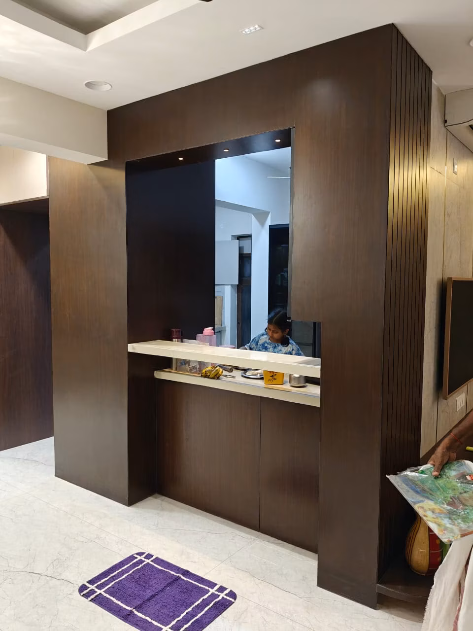 Premium modular kitchen layout with integrated appliances and pullout baskets